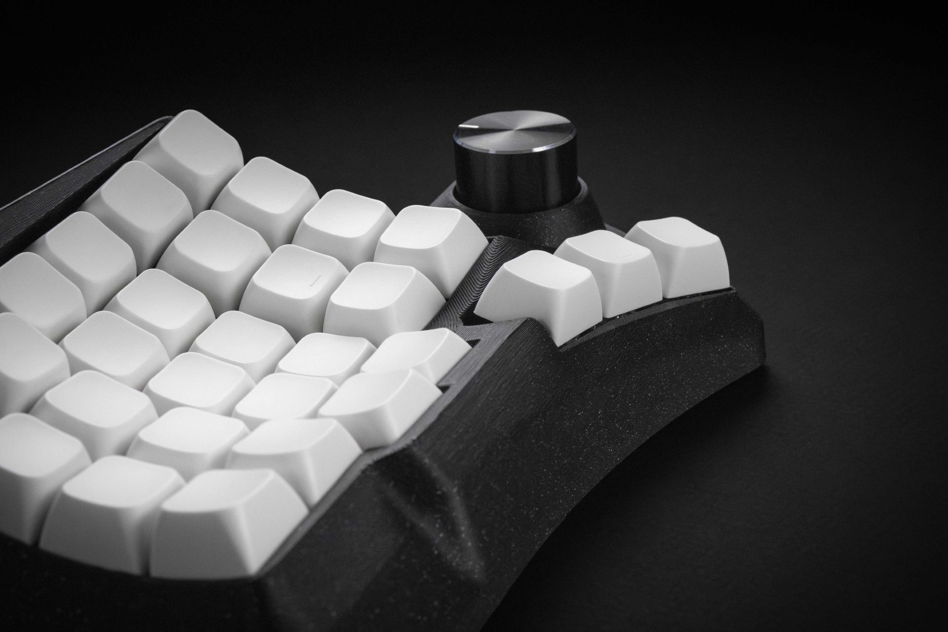 Close-up of the Phenom thumb keys and the curved case around them